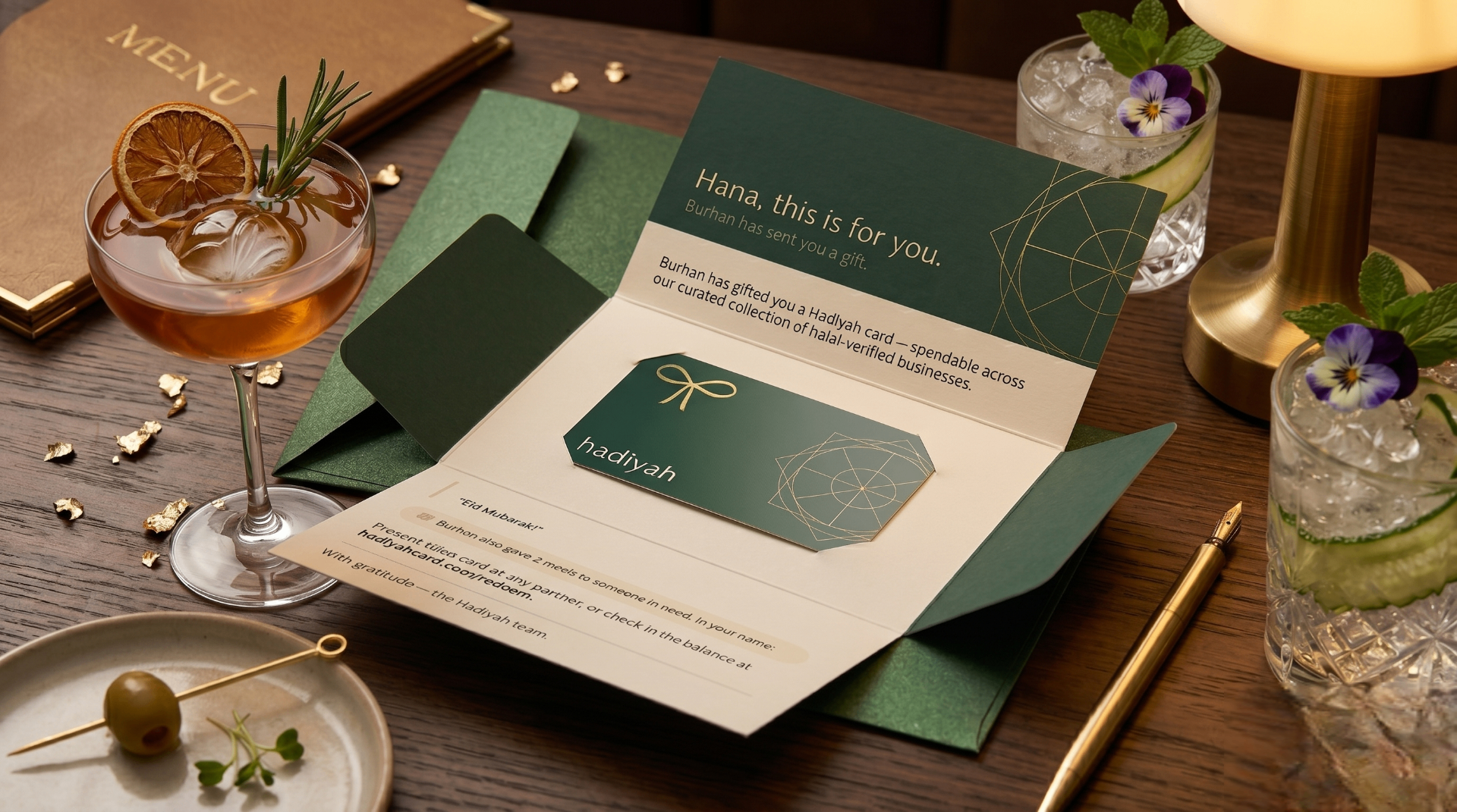 Romantic anniversary dinner setting with a Hadiyah gift card arranged beside glowing candles and elegant drinks