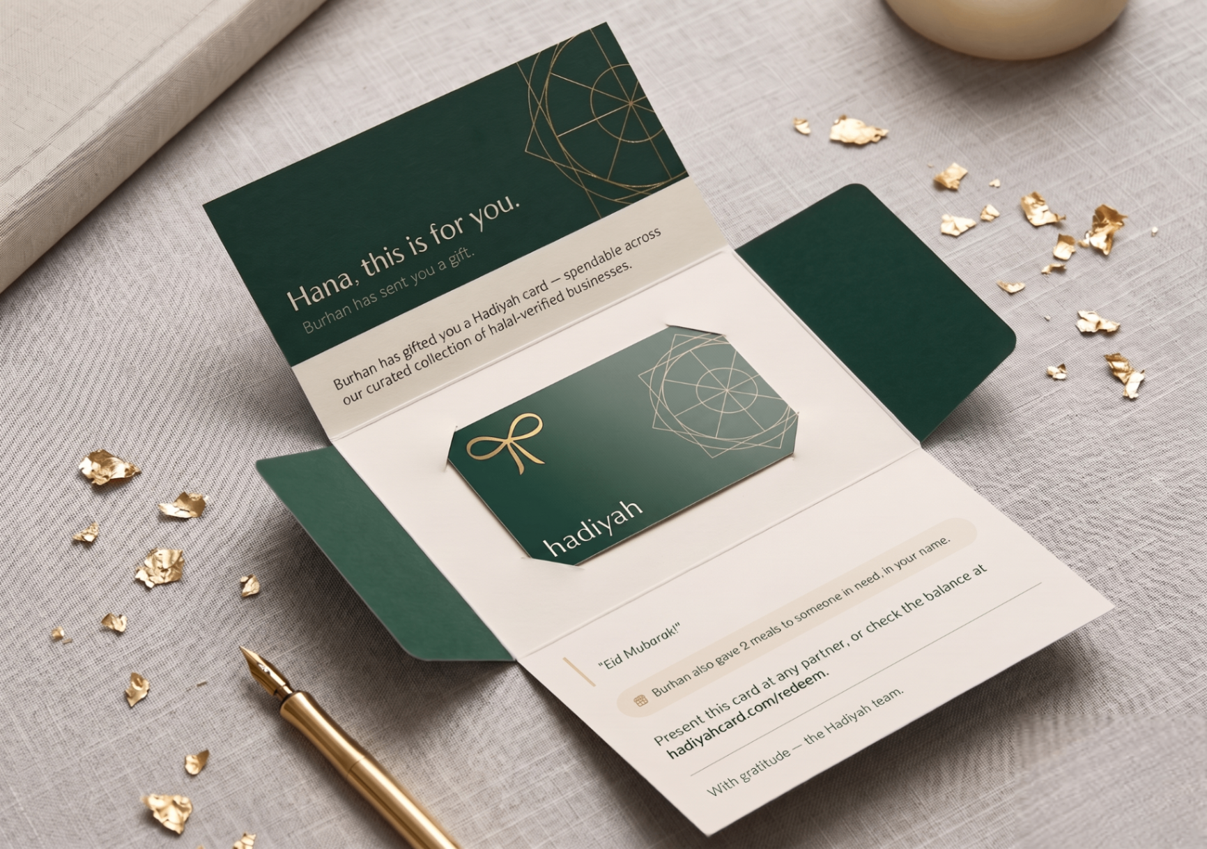 Luxurious opened Hadiyah thank-you gift card with intricate gold foil detailing on a marble surface